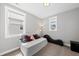 Cozy bedroom featuring a sofa, natural light, and modern amenities at 34 Millennium Dr, Pittsboro, NC 27312