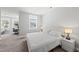 Bright bedroom boasts a king bed and an open office area at 34 Millennium Dr, Pittsboro, NC 27312