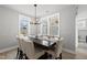 Bright dining area with a large table, comfortable seating, and ample natural light at 34 Millennium Dr, Pittsboro, NC 27312