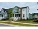 Charming two-story home with a combination of blue, brown, and white siding at 34 Millennium Dr, Pittsboro, NC 27312