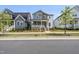 Attractive two-story home with a charming front porch and manicured landscaping, nestled in a friendly neighborhood at 34 Millennium Dr, Pittsboro, NC 27312