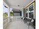 Relaxing front porch with cushioned chairs and an outdoor table at 34 Millennium Dr, Pittsboro, NC 27312