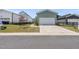Exterior view of a well-maintained garage with a driveway and landscaping at 34 Millennium Dr, Pittsboro, NC 27312