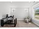 Well-lit home office space with a modern desk, comfortable chair, and ample natural light at 34 Millennium Dr, Pittsboro, NC 27312