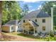 Aerial view of the home's backyard showing patio, fire pit, porch, and manicured lawn at 3540 Rugby Rd, Durham, NC 27707