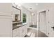 Bathroom featuring a glass-enclosed shower, a large mirror, and a stylish vanity with grey countertops at 3540 Rugby Rd, Durham, NC 27707