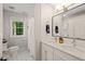 Bright bathroom with a double sink vanity, subway tile, and combination shower and bathtub at 3540 Rugby Rd, Durham, NC 27707