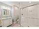 Clean bathroom with white vanity, a glass-enclosed shower, and neutral tile flooring, designed for relaxation at 3540 Rugby Rd, Durham, NC 27707