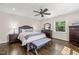 Bedroom with a ceiling fan, hardwood floors, ample natural light, and traditional-style furnishings at 3540 Rugby Rd, Durham, NC 27707