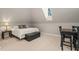 Cozy bonus room featuring a sleeping area and dining table at 3540 Rugby Rd, Durham, NC 27707