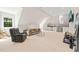 Large bonus room with wet bar, plush carpeting, and windows for natural light at 3540 Rugby Rd, Durham, NC 27707