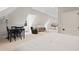 Expansive bonus room featuring multiple seating areas, a dining area, and a kitchenette at 3540 Rugby Rd, Durham, NC 27707