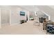 Spacious bonus room with tv, comfortable seating, and small kitchenette area at 3540 Rugby Rd, Durham, NC 27707