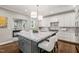 Stylish kitchen with large island, marble countertops, and pendant lighting at 3540 Rugby Rd, Durham, NC 27707