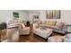 Spacious living room with hardwood floors, comfortable sofas, a fireplace, and large windows at 3540 Rugby Rd, Durham, NC 27707