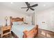 Bedroom featuring hardwood floors, with a ceiling fan, natural light and closet access at 3540 Rugby Rd, Durham, NC 27707