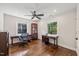 Bright office space featuring hardwood floors, two desks, natural light from two windows and ceiling fan at 3540 Rugby Rd, Durham, NC 27707