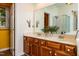Bathroom with double vanity and large mirrors plus lots of storage and light at 3616 Culater Ct, Raleigh, NC 27616