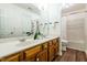 Bright bathroom with double vanity, lots of mirror space, and shower with tub at 3616 Culater Ct, Raleigh, NC 27616