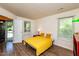 Comfortable bedroom features hardwood floors, and an adjacent exterior entry door at 3616 Culater Ct, Raleigh, NC 27616