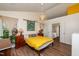 Bright bedroom features vaulted ceilings, hardwood floors, and ensuite bathroom with shower and tub at 3616 Culater Ct, Raleigh, NC 27616