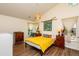Bright bedroom features vaulted ceilings, hardwood floors, and large windows that fill the room with light at 3616 Culater Ct, Raleigh, NC 27616