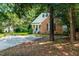 Charming home with a brick facade, siding, a well-manicured lawn, and a paved driveway at 3616 Culater Ct, Raleigh, NC 27616