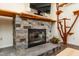 Living area showcasing a stone fireplace and a unique cat tree at 3616 Culater Ct, Raleigh, NC 27616