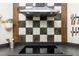 Stylish kitchen features stainless steel hood vent and black and white backsplash at 3616 Culater Ct, Raleigh, NC 27616