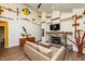 Bright living room with high ceilings, exposed beams, a stone fireplace, and unique wall decorations at 3616 Culater Ct, Raleigh, NC 27616