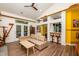 Bright living room with exposed beams, unique wall decorations and a view of the bar area at 3616 Culater Ct, Raleigh, NC 27616