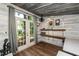 Bright outbuilding office with french doors and a view of the yard and trees at 3616 Culater Ct, Raleigh, NC 27616
