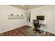 Bright office space featuring modern desk, floating shelves, and hardwood flooring at 3616 Culater Ct, Raleigh, NC 27616