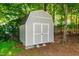 Outdoor storage shed has neutral paint and double doors for easy access at 3616 Culater Ct, Raleigh, NC 27616