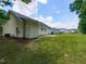Spacious backyard featuring a well-maintained lawn and ample space for outdoor activities at 381 Gray Ghost Ln, Benson, NC 27504
