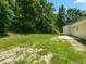 Lush backyard with a concrete patio, perfect for outdoor relaxation and entertaining at 381 Gray Ghost Ln, Benson, NC 27504