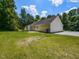 Expansive green backyard with trees at rear, offering privacy and ample space for entertaining at 381 Gray Ghost Ln, Benson, NC 27504