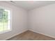 This minimalist bedroom has natural light from the window at 381 Gray Ghost Ln, Benson, NC 27504
