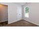This bedroom has neutral carpet, a large window and a closet at 381 Gray Ghost Ln, Benson, NC 27504