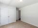 This bedroom offers ample closet space and is brightly lit by a ceiling light at 381 Gray Ghost Ln, Benson, NC 27504