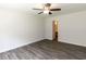 This bedroom has vinyl floors and access to the bathroom at 381 Gray Ghost Ln, Benson, NC 27504