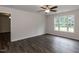 This bedroom has vinyl floors and a large window at 381 Gray Ghost Ln, Benson, NC 27504