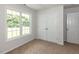 Cozy bedroom with a large window providing natural light and a spacious closet at 381 Gray Ghost Ln, Benson, NC 27504