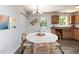 Cozy dining area with round table and chairs, adjacent to a modern kitchen at 381 Gray Ghost Ln, Benson, NC 27504