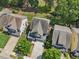 Aerial view of home featuring an attached garage, covered porch, and pristine landscaping at 3901 Yates Mill Trl, Raleigh, NC 27606