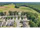 Aerial view of a neighborhood showcasing the home's location near green spaces and agriculture at 3901 Yates Mill Trl, Raleigh, NC 27606