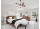 Well-staged bedroom with neutral colors, vaulted ceilings, ceiling fan, and coordinated decor and furnishings at 3901 Yates Mill Trl, Raleigh, NC 27606