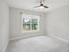 Well-lit bedroom with a large window offering picturesque outside views and soft carpeting at 3901 Yates Mill Trl, Raleigh, NC 27606
