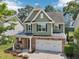 Charming two-story home with stone accents, a two-car garage and manicured landscaping at 3901 Yates Mill Trl, Raleigh, NC 27606