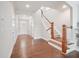 Welcoming foyer with hardwood floors, a staircase, and ample natural light at 3901 Yates Mill Trl, Raleigh, NC 27606